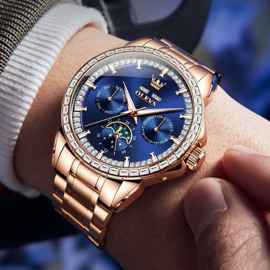 Luxury watch with rose gold case and blue dial on a wrist